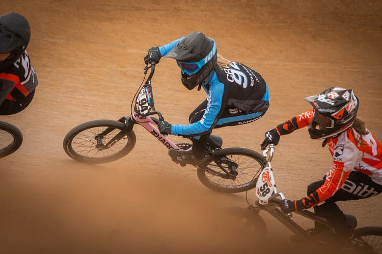 BMX racers on a dirt track