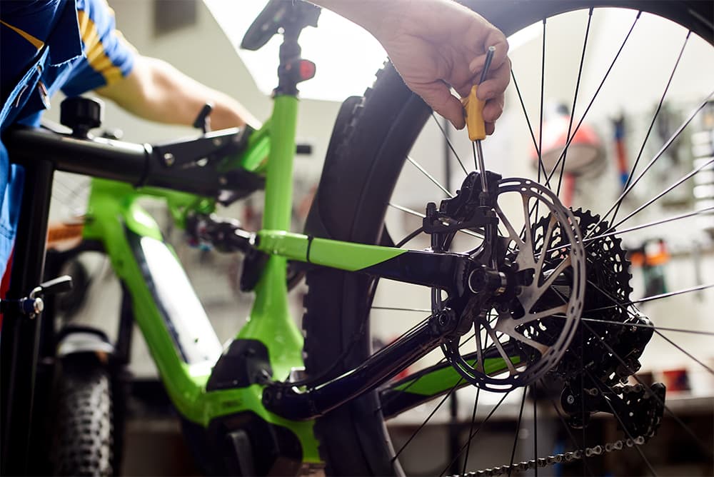 Bicycle Mechanic Servicing Disc Breaks Bicycle Mechanic Servicing Disc Breaks