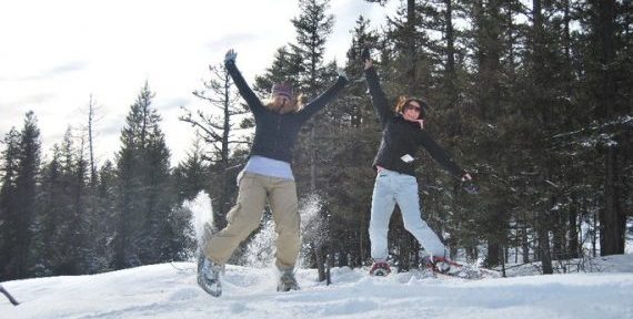 Snowshoers leaping
