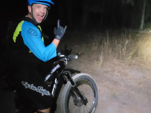 mountain biker on trail at night